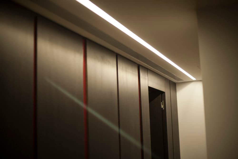 Timber paneling detail with recessed linear lighting
