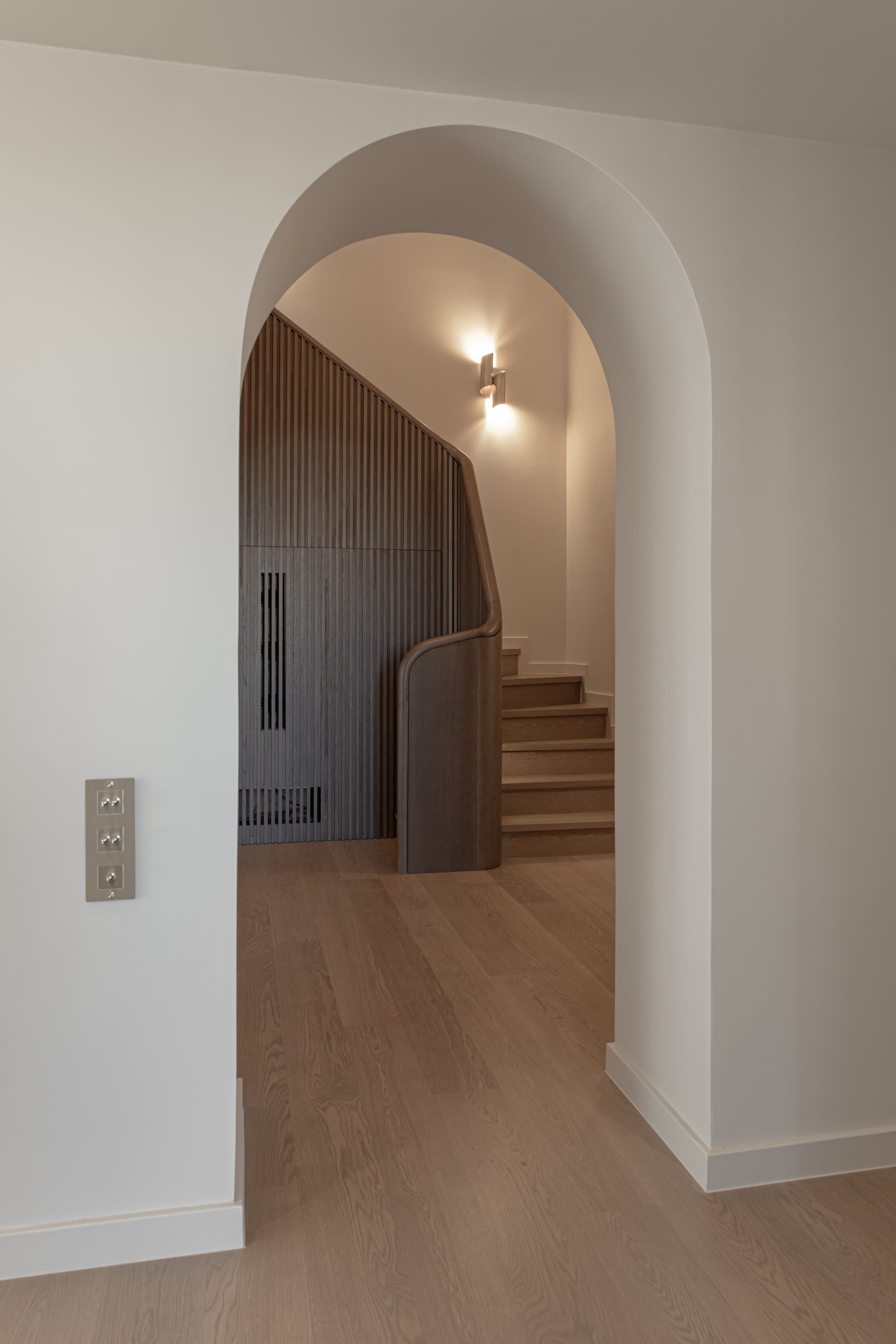 Arched opening to the sculpted staircase